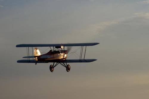 A Biplane Heading Toward The Sun